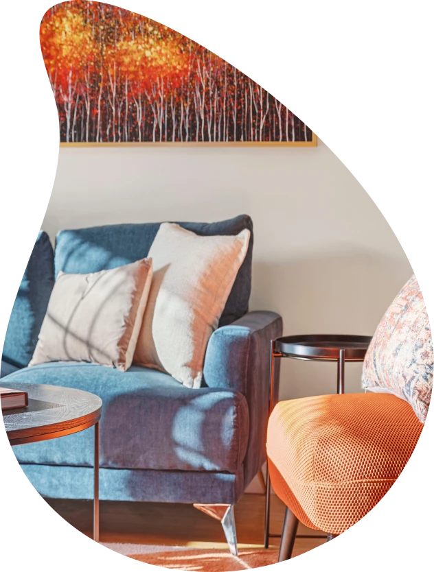 Styled living room with blue sofa and artwork in a Sepal Stays short-term rental in Perth