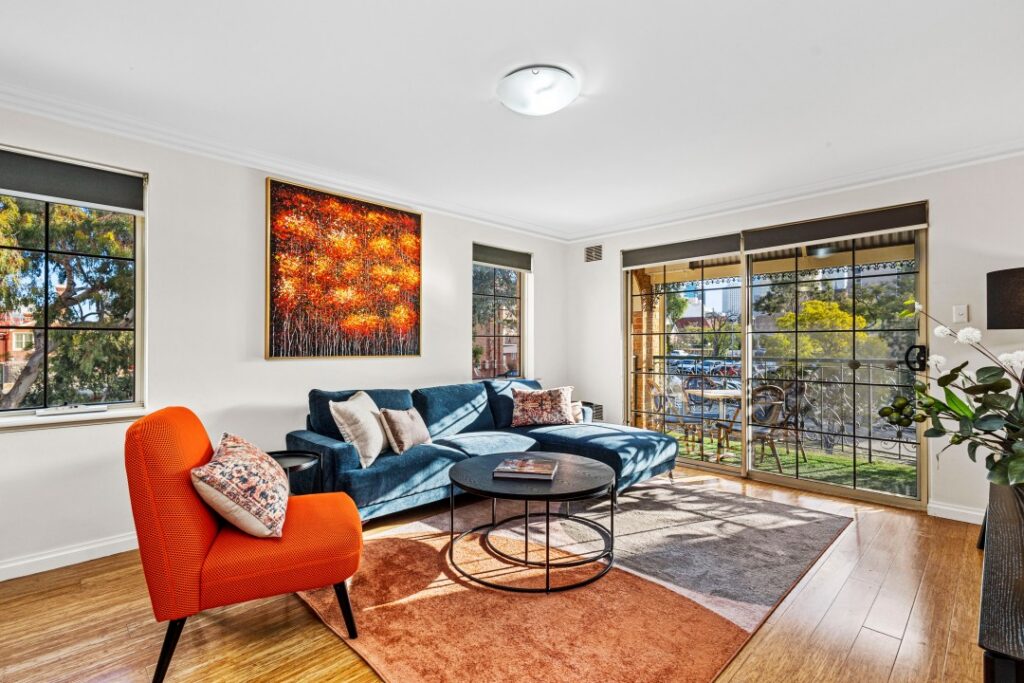 Bright living room with modern furniture in The Bishops Escape in East Perth.