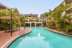 Serene pool surrounded by greenery in The Bishops Escape in East Perth