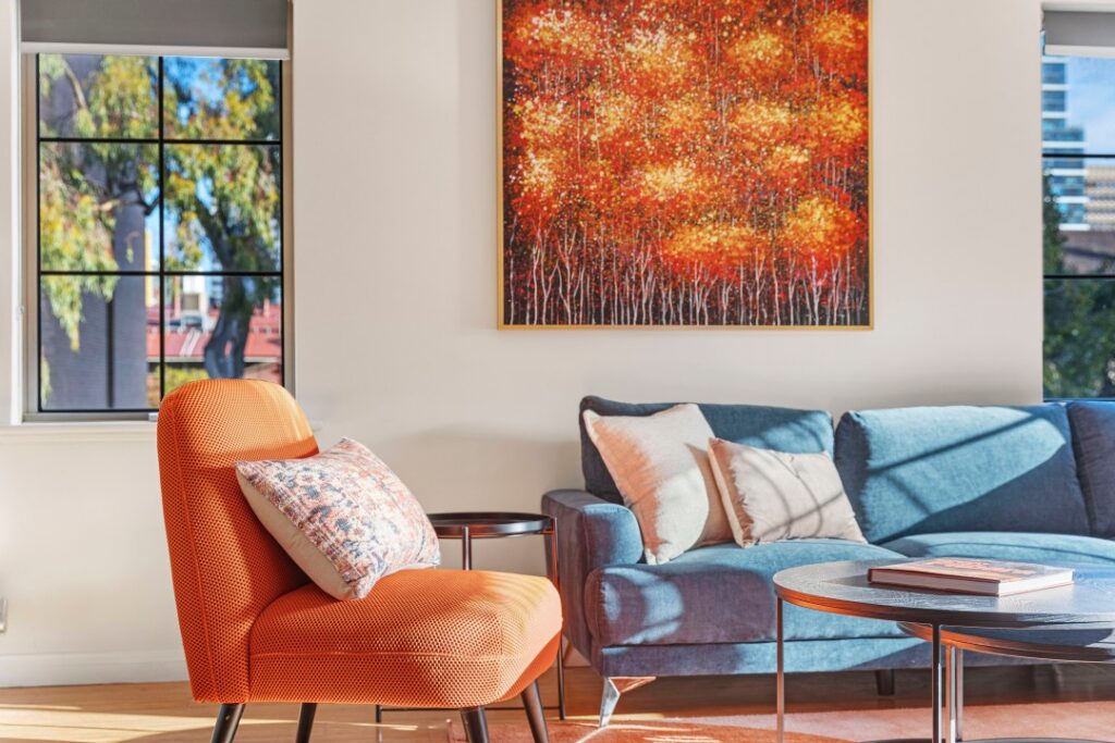 Bright living room with cozy sofa in The Bishops Escape in East Perth.