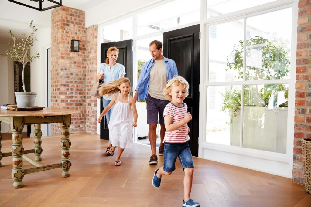 Family entering a bright, welcoming home.
