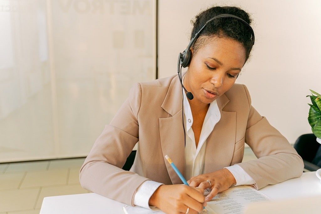 Person working at a help desk.