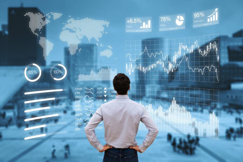 Person analyzing financial data visuals.