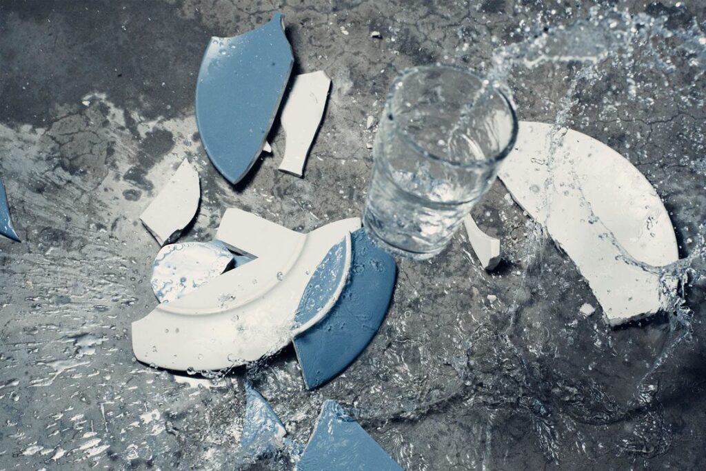 Shattered plates with spilled water